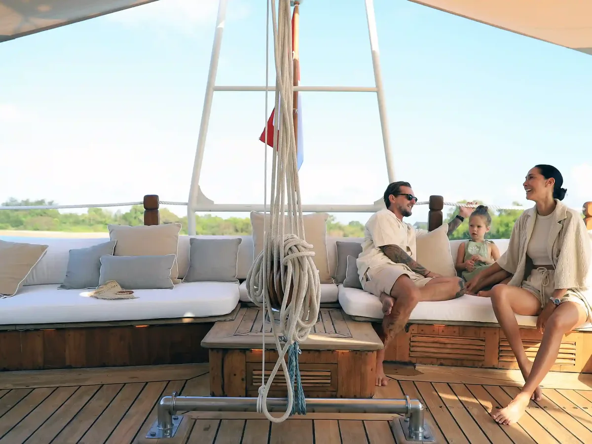 A family together on the deck of a boat